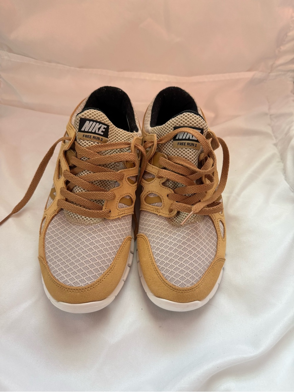 Nike tan and white Free Run casual sneakers